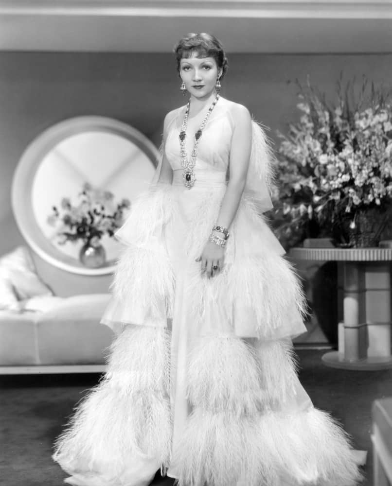 Claudette Colbert, in GILDED LILY, 1935, in Travis Banton  gown trimmed in vulture feathers